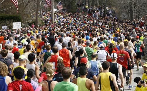 Runners start the 117th running of the Boston Marathon, in Hopkinton, Mass., Monday, April 15, 2013