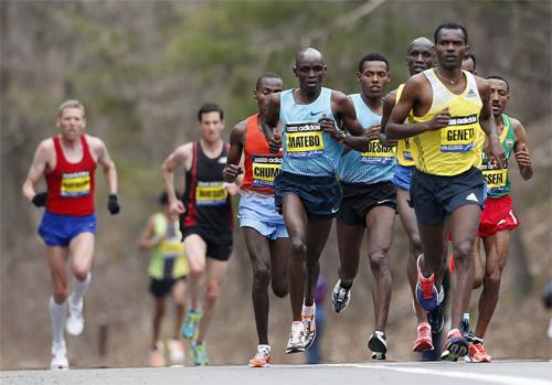Elite mens marathoners including Levy Matebo, fourth from left, and Markos Geneti, front right, run in the 117th Boston Marathon